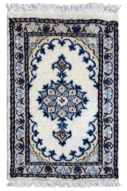 Nain rug 57×37 cm with a blue-and-white ornamental pattern and fringes