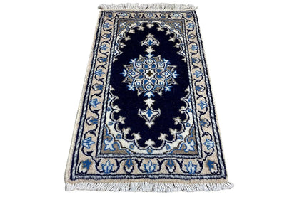 Nain rug 64x39 cm, dark blue with a central medallion and light blue borders