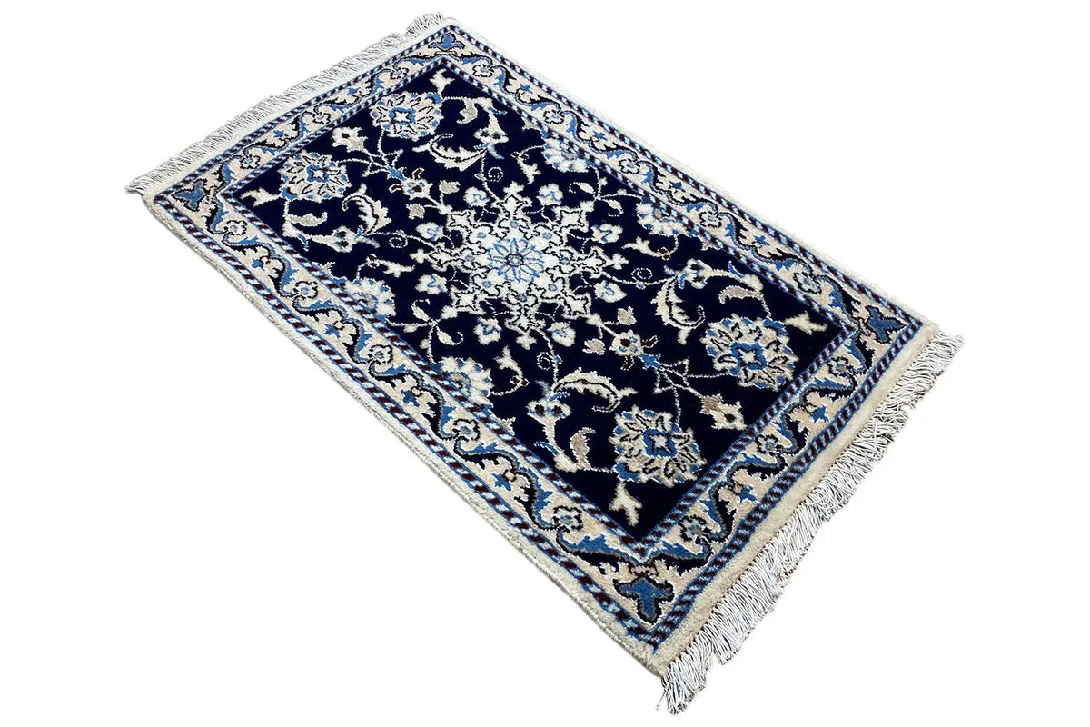 Nain rug 90x59 cm diagonal view, dark blue ornamental pattern, fringes
