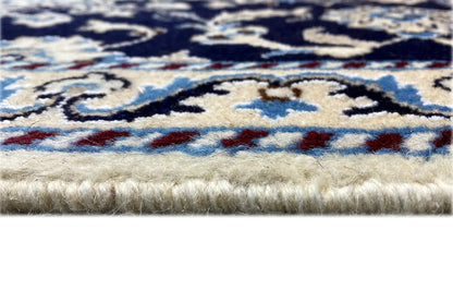 Nain rug 90x59 cm Detail: Woven texture and fringes along the edge