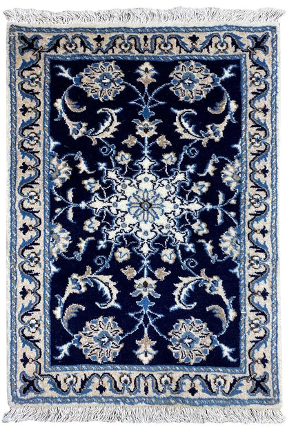 Blue oriental rug with fringes, drawn ornamental pattern in beige and light blue