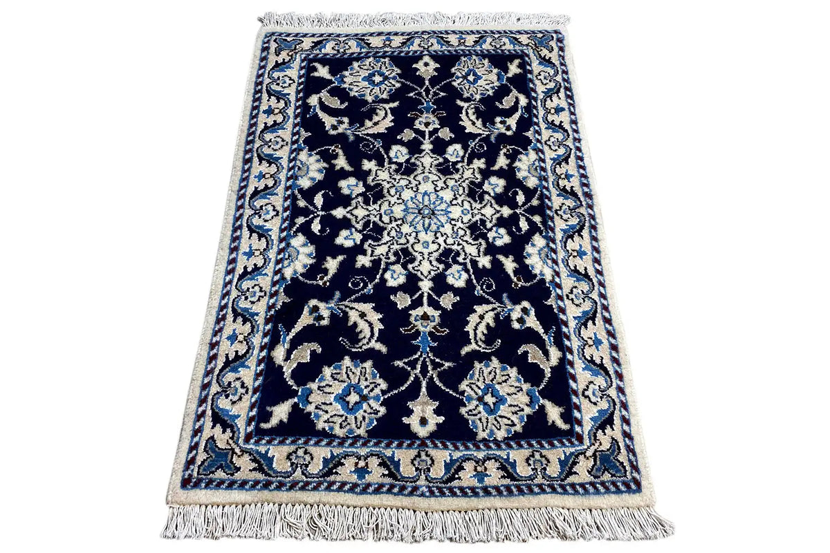 Nain rug 90x61 cm, tilted sideways, with fringes and a blue-beige ornamental pattern