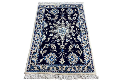 Nain rug 90x61 cm, tilted sideways, with fringes and a blue-beige ornamental pattern