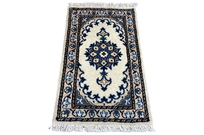 Nain rug 65x39 cm angled: white background, blue medallion, fringes