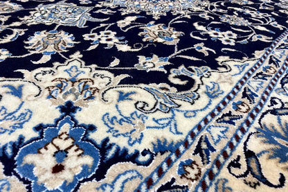 Close-up: rug with dark blue, beige ornaments, and a finished edge