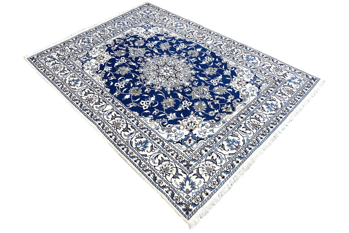 Blue-and-white Nain rug with medallion pattern, diagonally oriented view