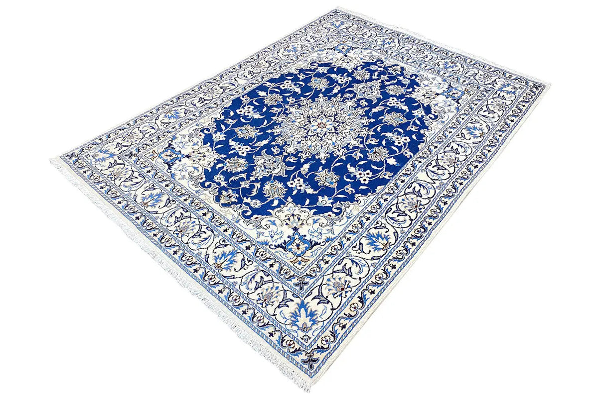 Blue-and-white Nain rug with medallion design, diagonally oriented, decorative border