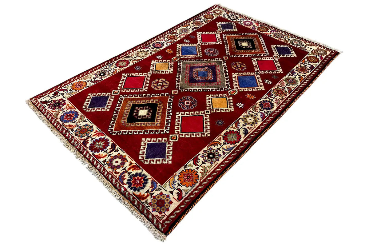 Oriental rug with a red background, geometric pattern and colorful border, narrow fringes
