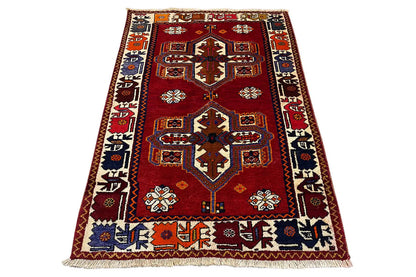 Red carpet in Shiraz-Qashqai design with a central medallion and borders