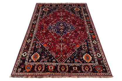 Oriental rug, red with blue medallion, border, and short fringe