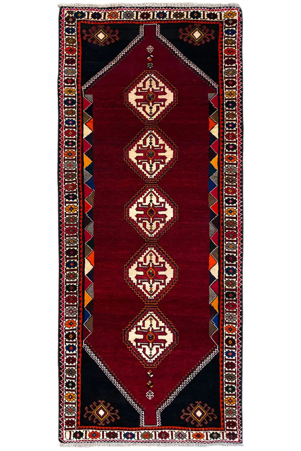 Burgundy runner rug with geometric diamonds and a decorative border
