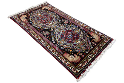 Oriental rug with two medallions, colorful border and fringes, 114x59 cm.