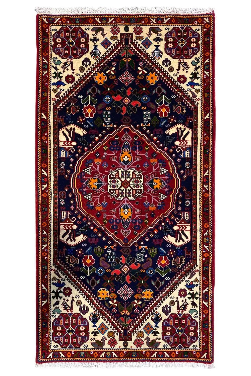 Oriental rug with a red border, dark blue background, and colorful patterns