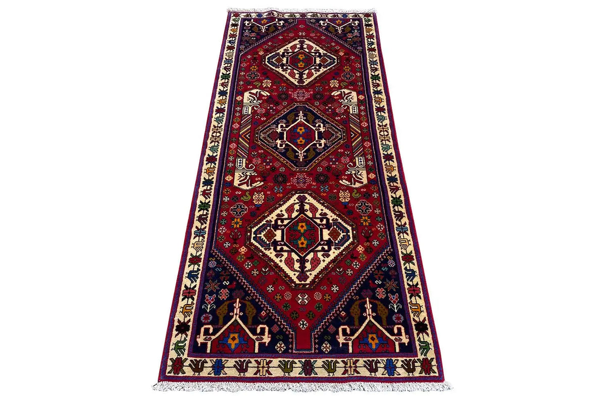 Rug, red and dark blue central pattern with border and fringes, approx. 195x79 cm.
