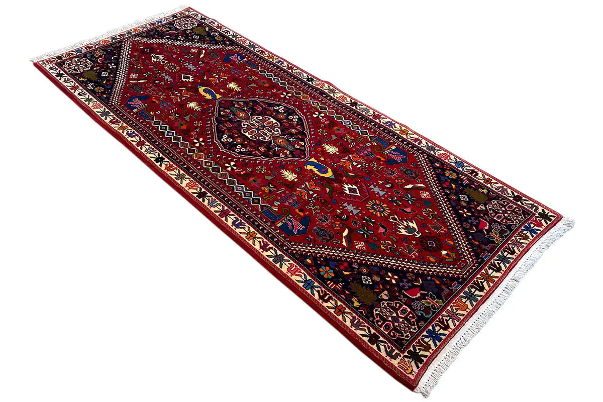 Long-format Oriental rug, red pattern with medallion and wide decorative border