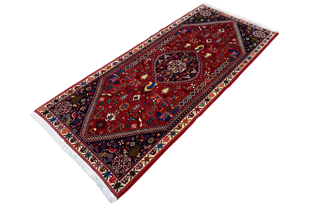 Long-format Oriental rug, red pattern with a medallion and contrasting border ornaments