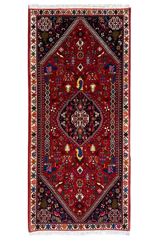 Oriental rug with a red ground and geometric medallion, blue and gold ornaments, 206x85 cm