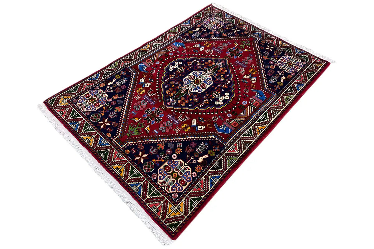 Oriental rug with a red medallion in the center and multicolored decorative ornaments