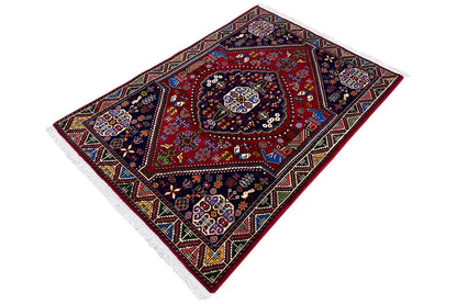 Oriental rug with a red medallion in the center and multicolored decorative ornaments
