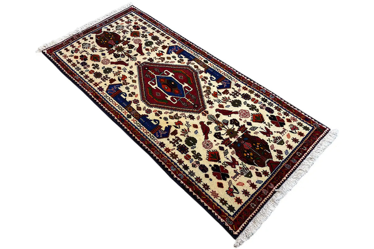 Oriental rug in cream with a red and blue pattern, border, fringes, 153x72 cm