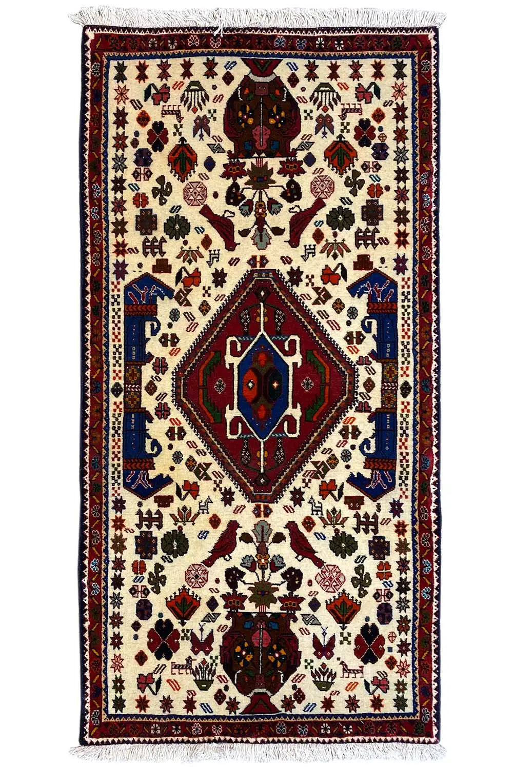 Oriental rug with a cream-colored base, red/blue medallion, fringes, 153x72 cm