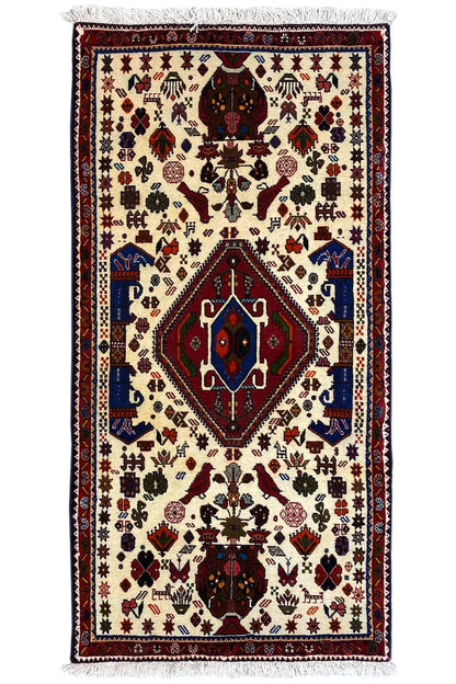 Oriental rug with a cream-colored base, red/blue medallion, fringes, 153x72 cm