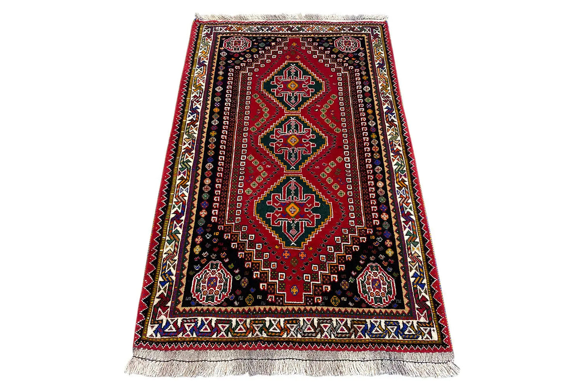 Rug with an oriental border pattern, red, dark blue and colorful accents, fringes