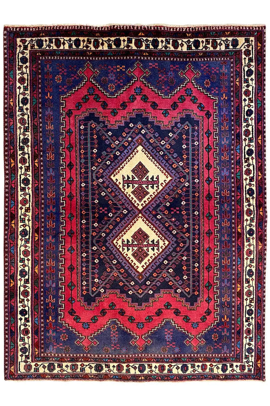 Sirjan rug, front view, blue central medallion with red accents and border