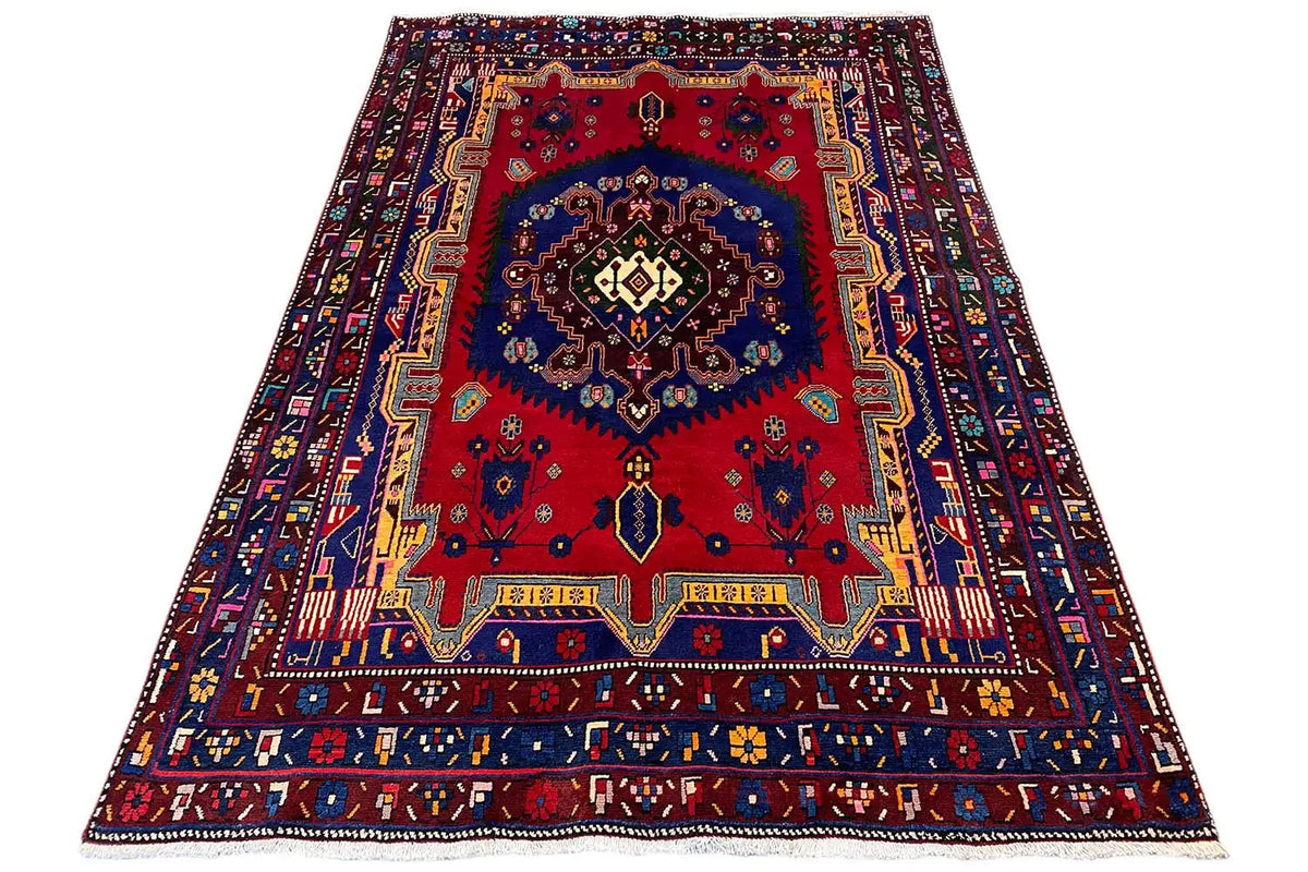 Oriental rug 250x166 cm with a red medallion and blue border pattern