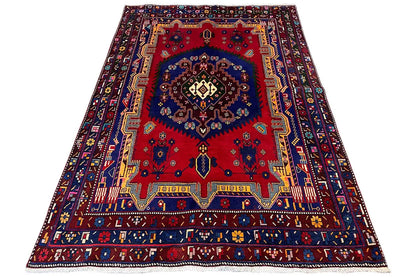 Oriental rug 250x166 cm with a red medallion and blue border pattern