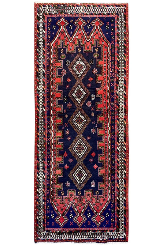 Sirjan runner, blue rug with a red and black ornamental pattern, rectangular.