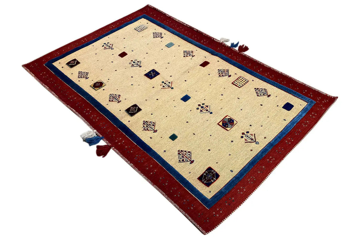 Carpet viewed diagonally: beige background, red border, blue edging
