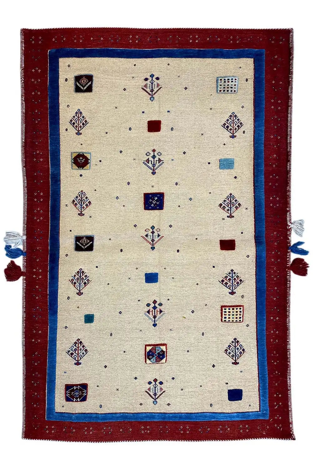 Beige rug with a red border, colorful ornaments, and tassels