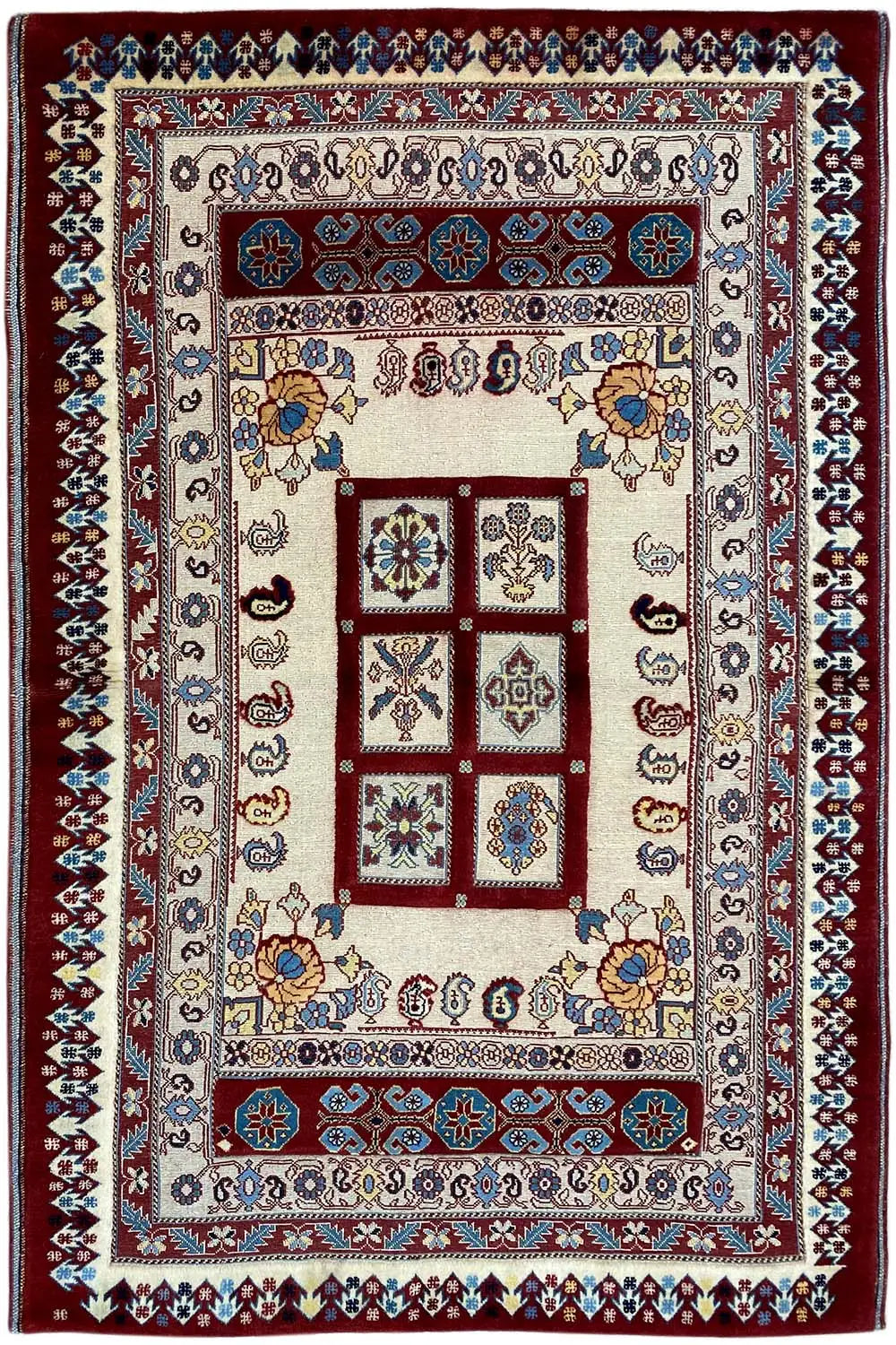 Rug 168x106 cm with a large central field, decorative border, and a mix of blue and red hues