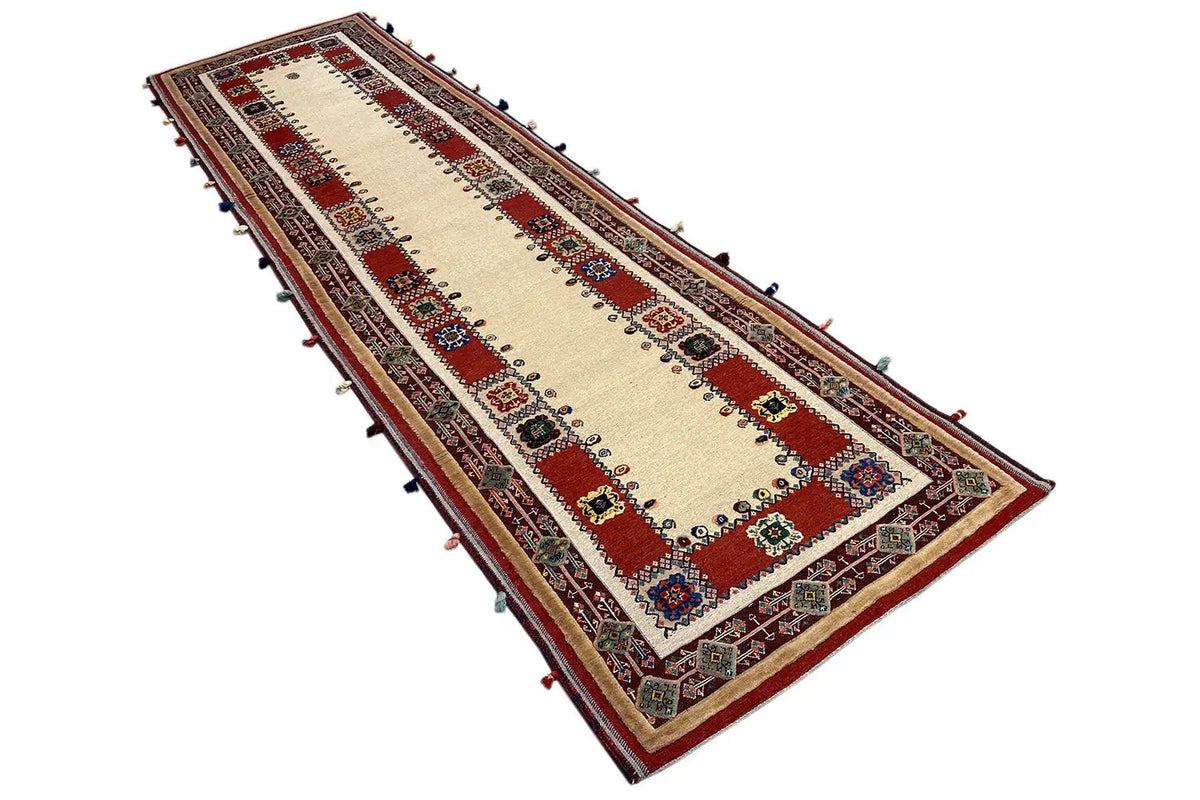 Soumak runner 308x83 cm: beige field with red panels, multicolored border, fringe