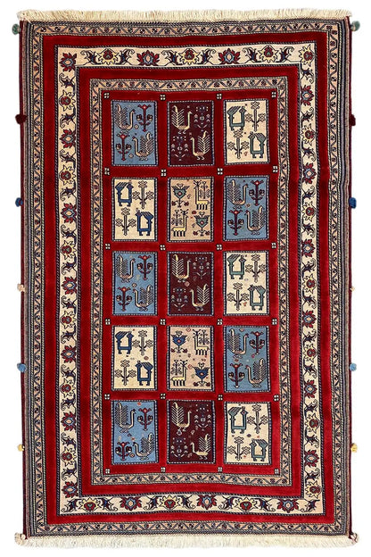 Rug with a central grid of red, blue, and beige motifs, wide border