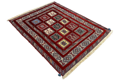 Oriental rug in red with a diagonal view and multicolored panel patterns