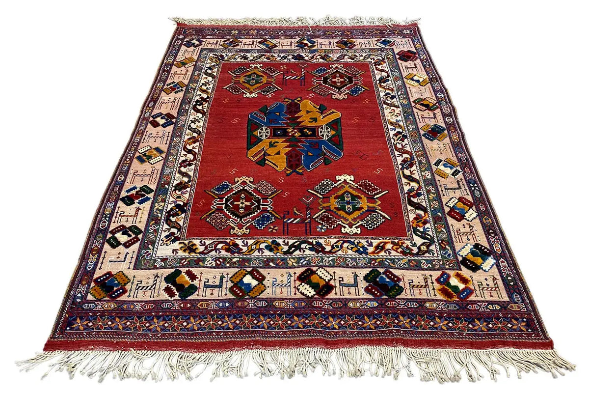 Soumakh rug (200x145 cm) with a red center, colorful borders, and white fringes