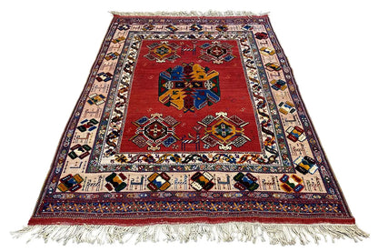 Soumakh rug (200x145 cm) with a red center, colorful borders, and white fringes