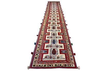 Oriental rug runner, tapering narrowly, red pattern with multicolored embellishments