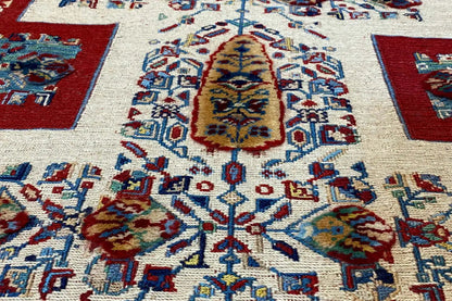 Oriental rug runner detail with large medallions in blue, red, and yellow