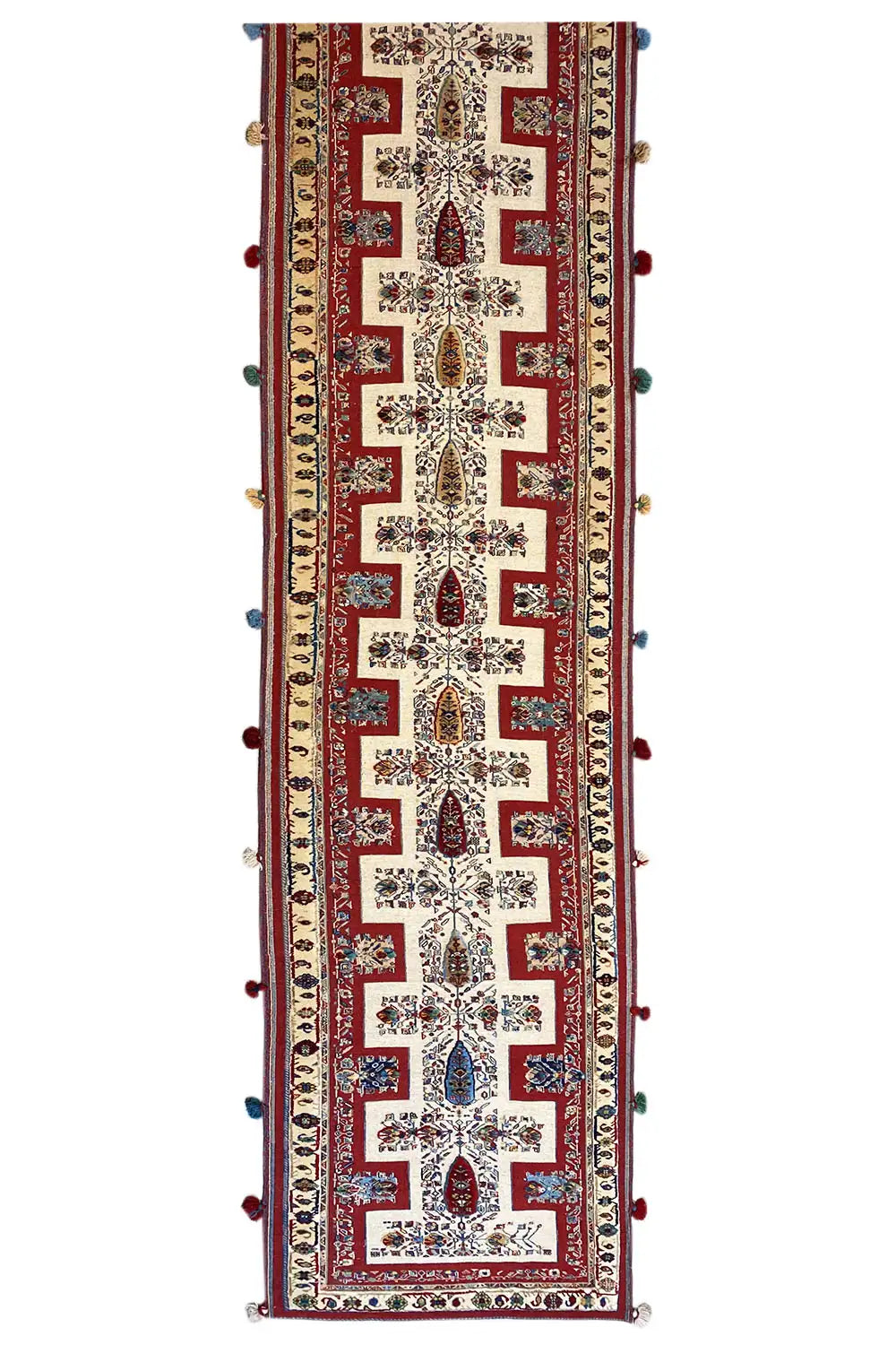 Oriental rug runner, narrow design, cream-colored base with a red pattern and fringes