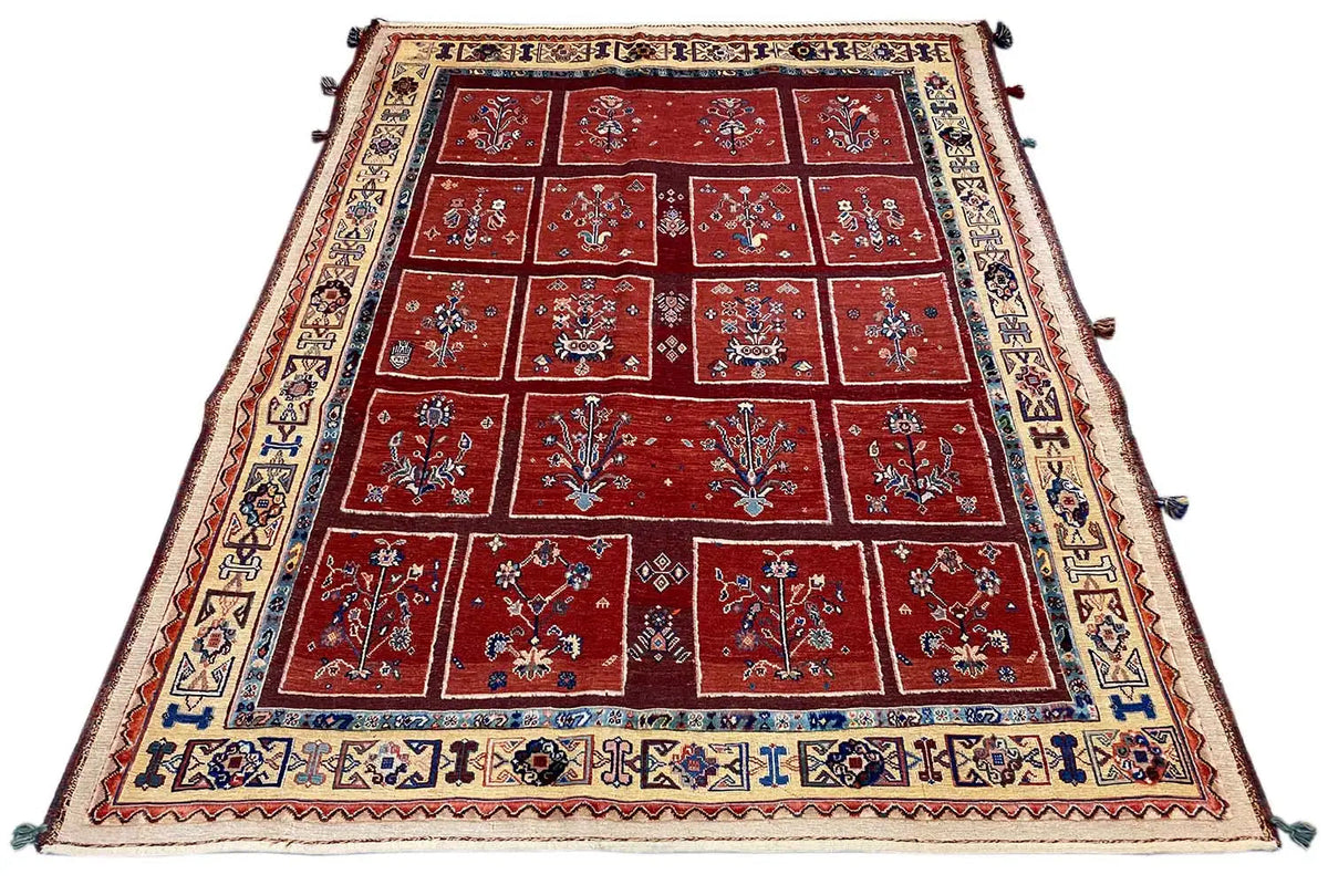 Carpet 183x147 cm: red square design with a blue border and fringes at the corners.