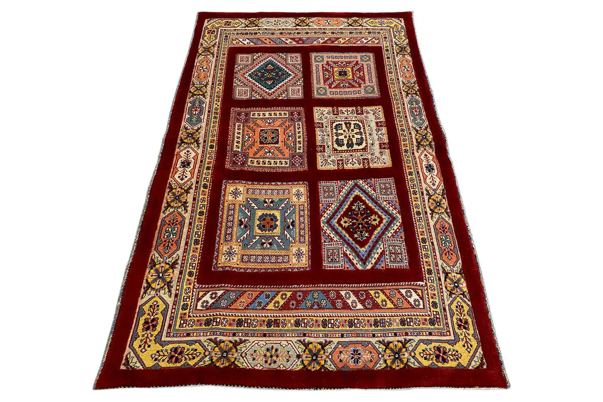 Rug 144x102 cm in a standing look: red base with geometric patchwork designs