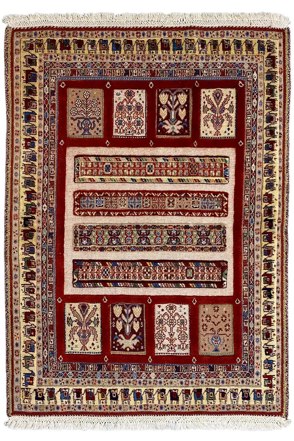 Oriental rug 139×103 cm: red medallion field, cream-colored border, fringes