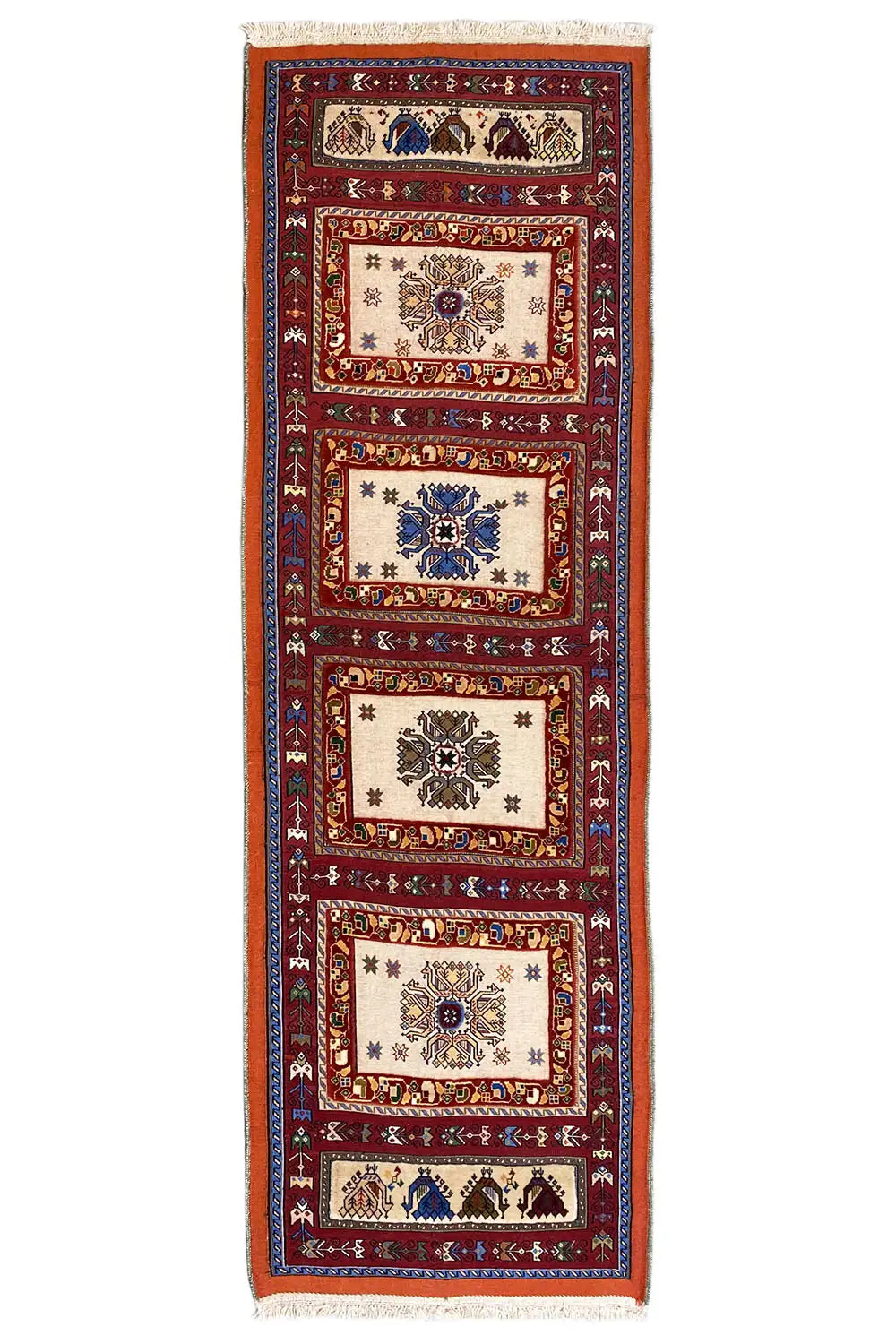 Long runner rug with a vertical stripe pattern in red, blue, and cream, with fringes at the top.