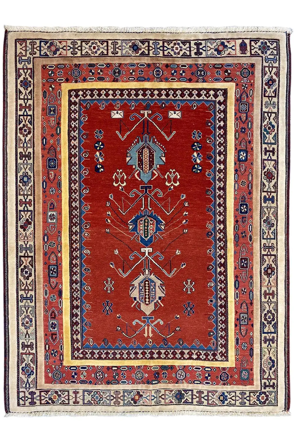 Carpet with a red central field, blue motif columns, and a wide patterned border