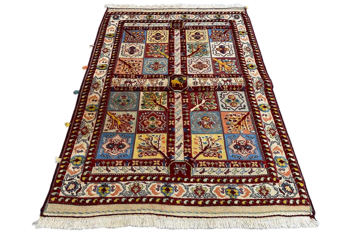 Soumak rug, front view, multicolored red grid pattern with border and fringes