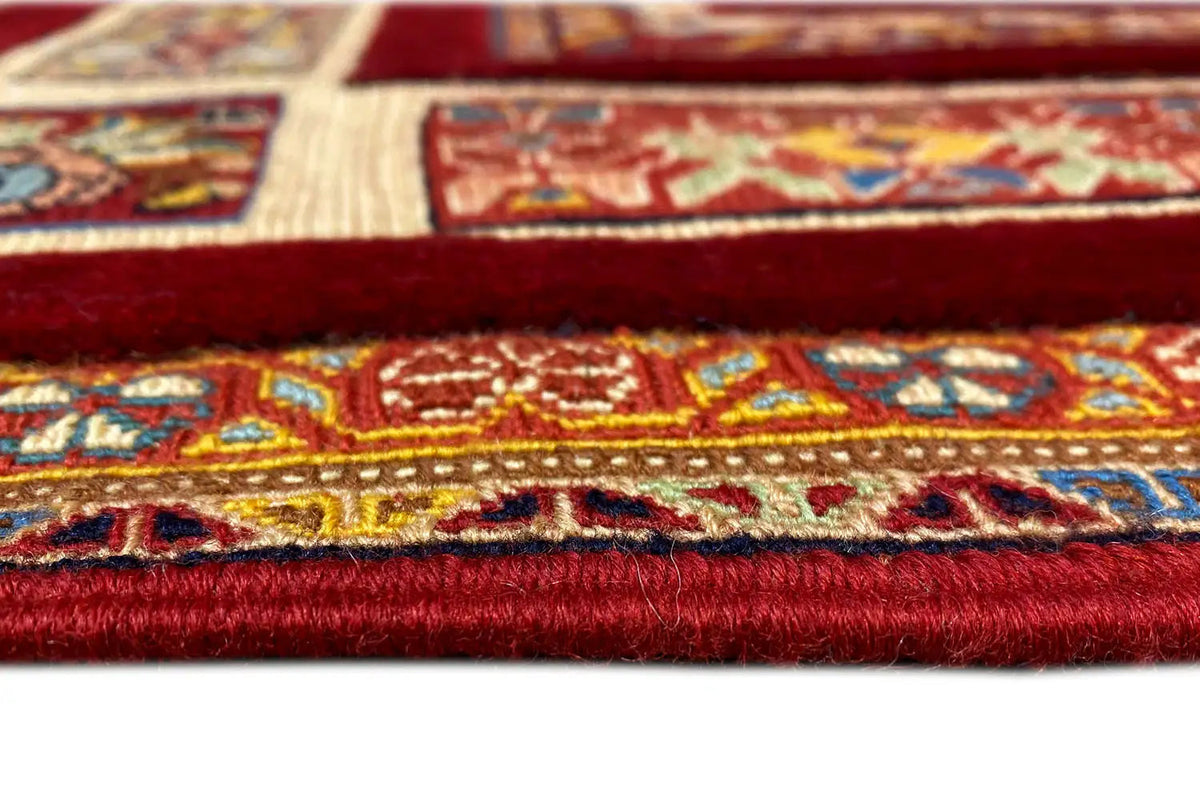 Soumak rug (147 x 103 cm): Detail of the red border with multicolored patterns