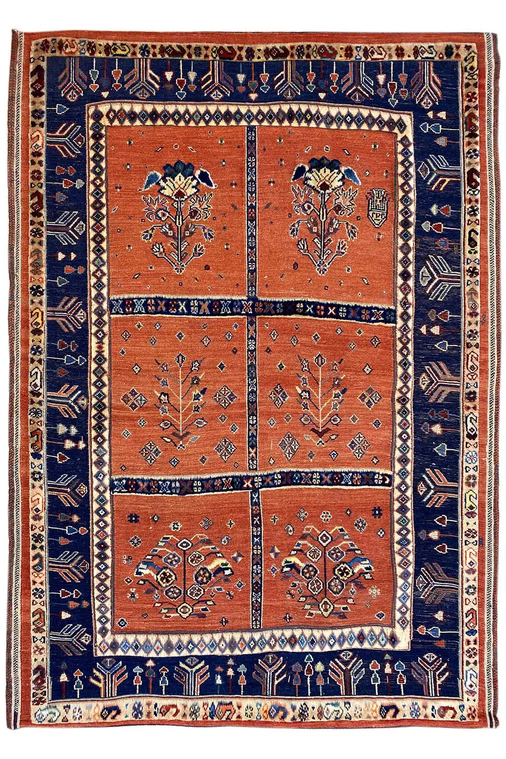 Soumak rug, rectangular, dark blue border and orange fields with four ornamental medallions